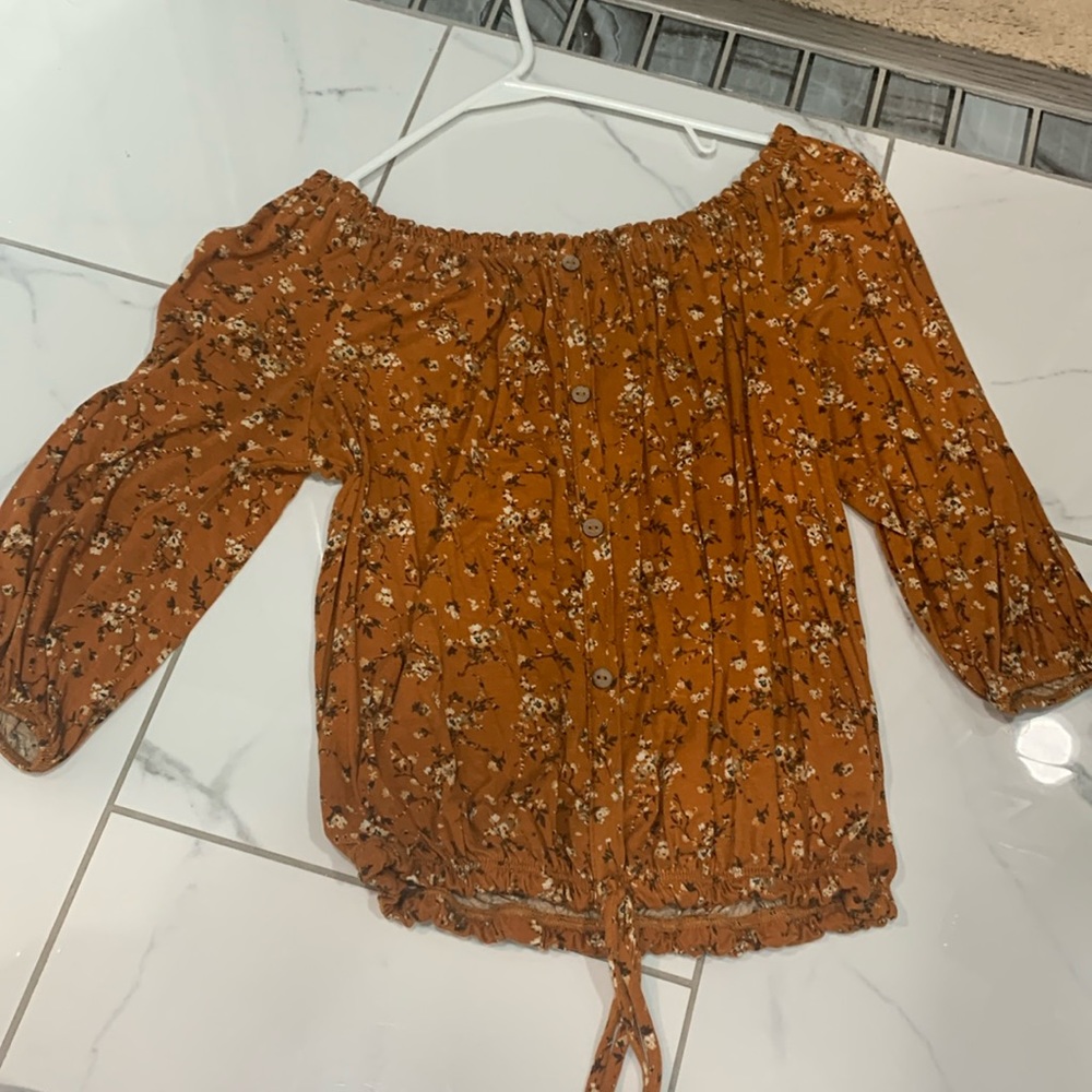 Brown colored off the shoulder top with flower designs